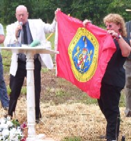 Commissioner�Larry Jarboe presenting St. Mary's County Flag to Patricia Buck to display in Confederate Memorial Park